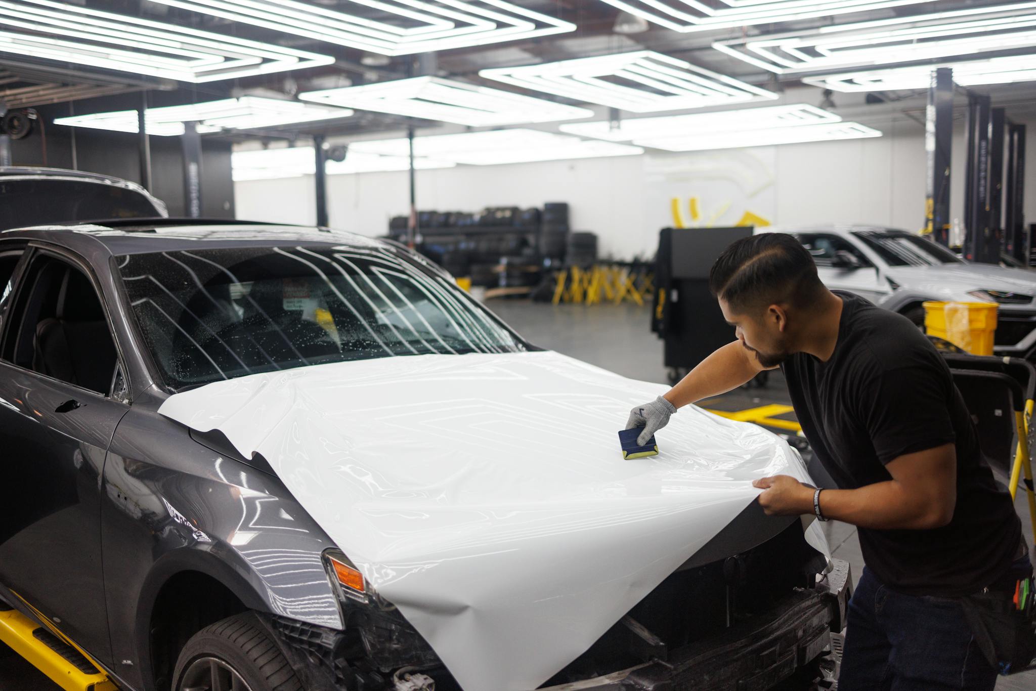 Squeegeeing white vinyl — hood